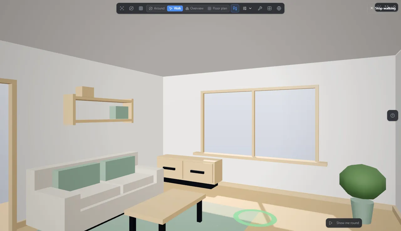 The same room in walk mode at eye height, with a ring on the floor where a tap or a click will walk to.